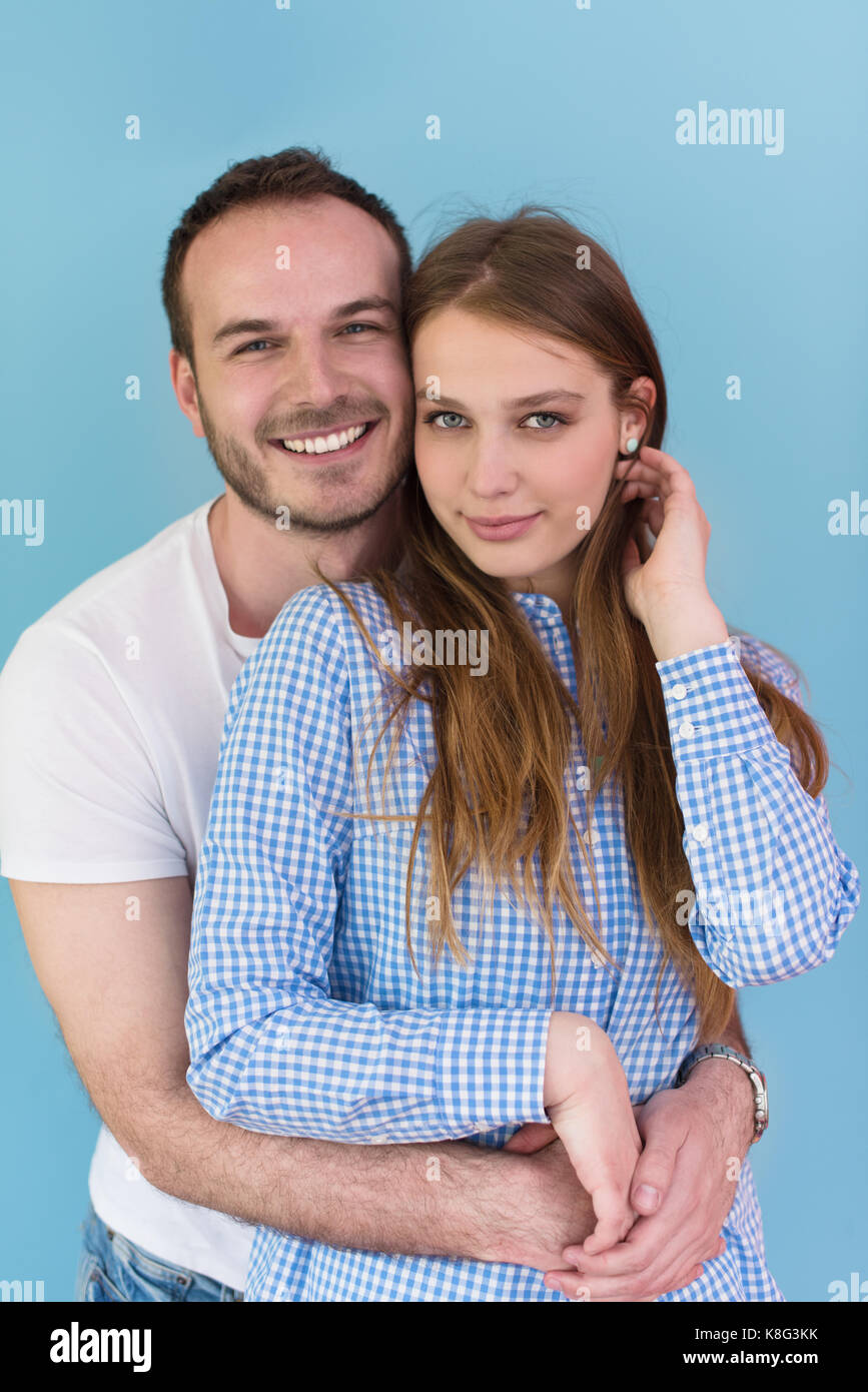 portrait of happy young loving couple looking at camera isolated on ...
