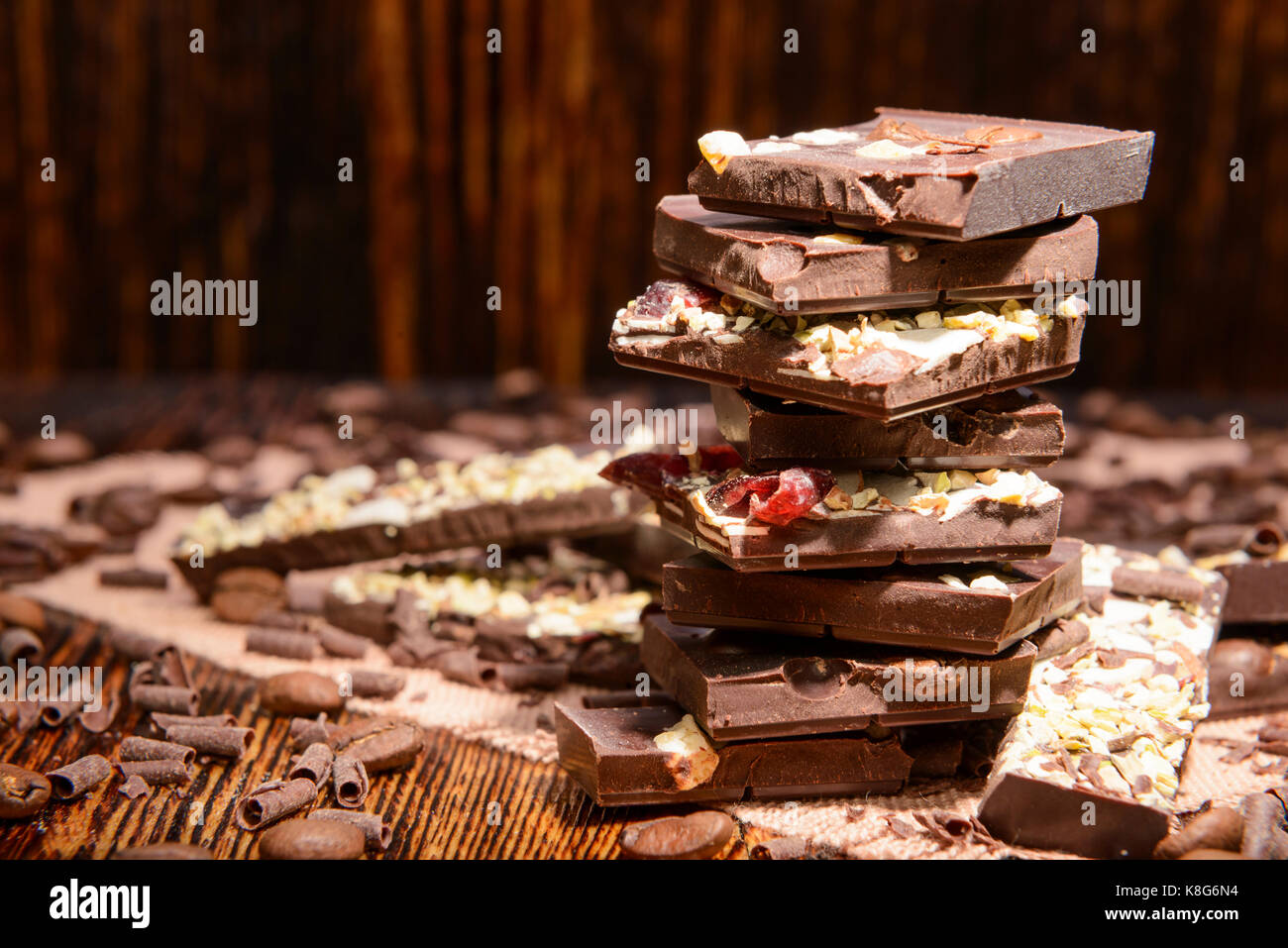 stack of chocolate on a wooden background Stock Photo - Alamy