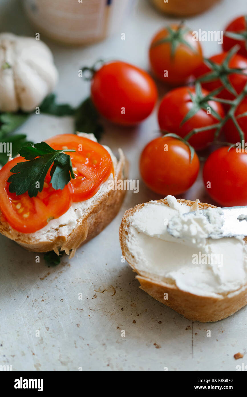 High angle view of cherry tomatoes and bread on table Stock Photo