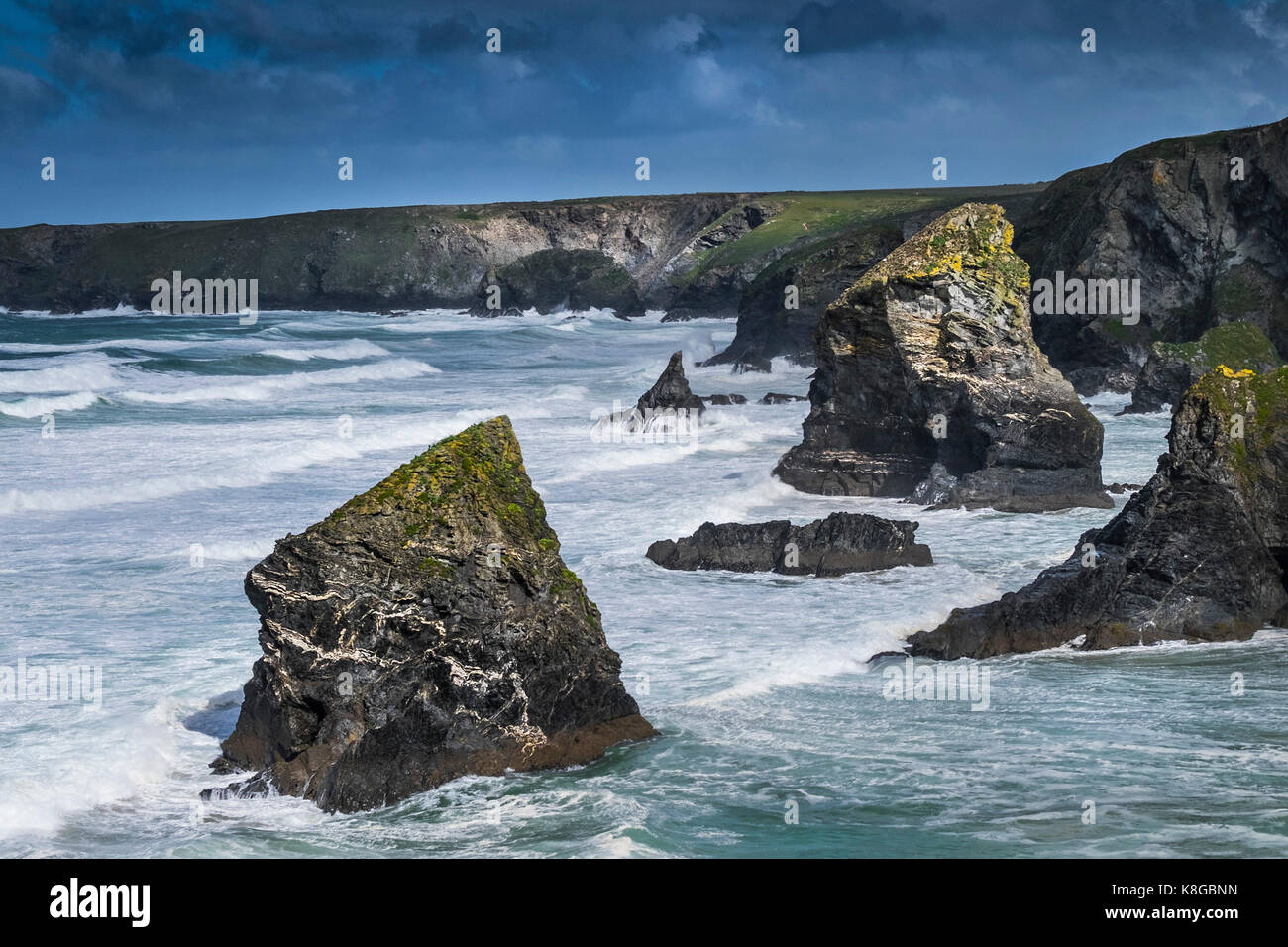 Bedruthan Steps - rough sea conditions at Bedruthan Steps on the North Cornwall coast. Stock Photo