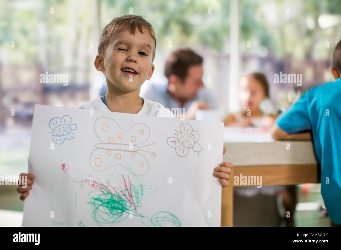 Boy showing drawing Stock Photo