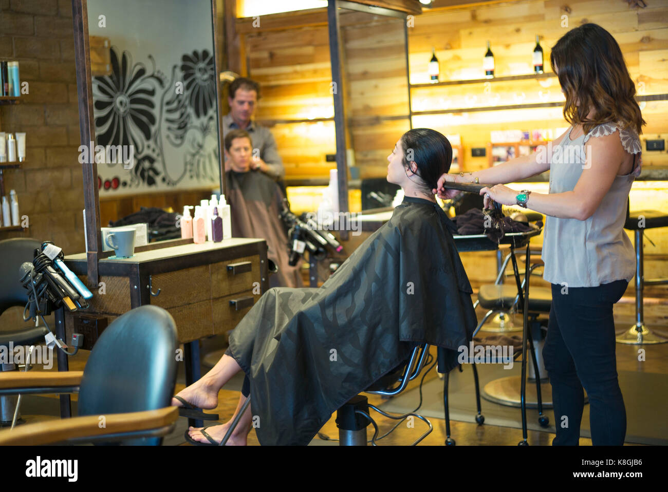 Hairstylists working in salon Stock Photo Alamy