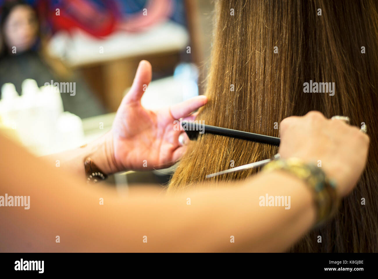 Hairstylist working in salon Stock Photo