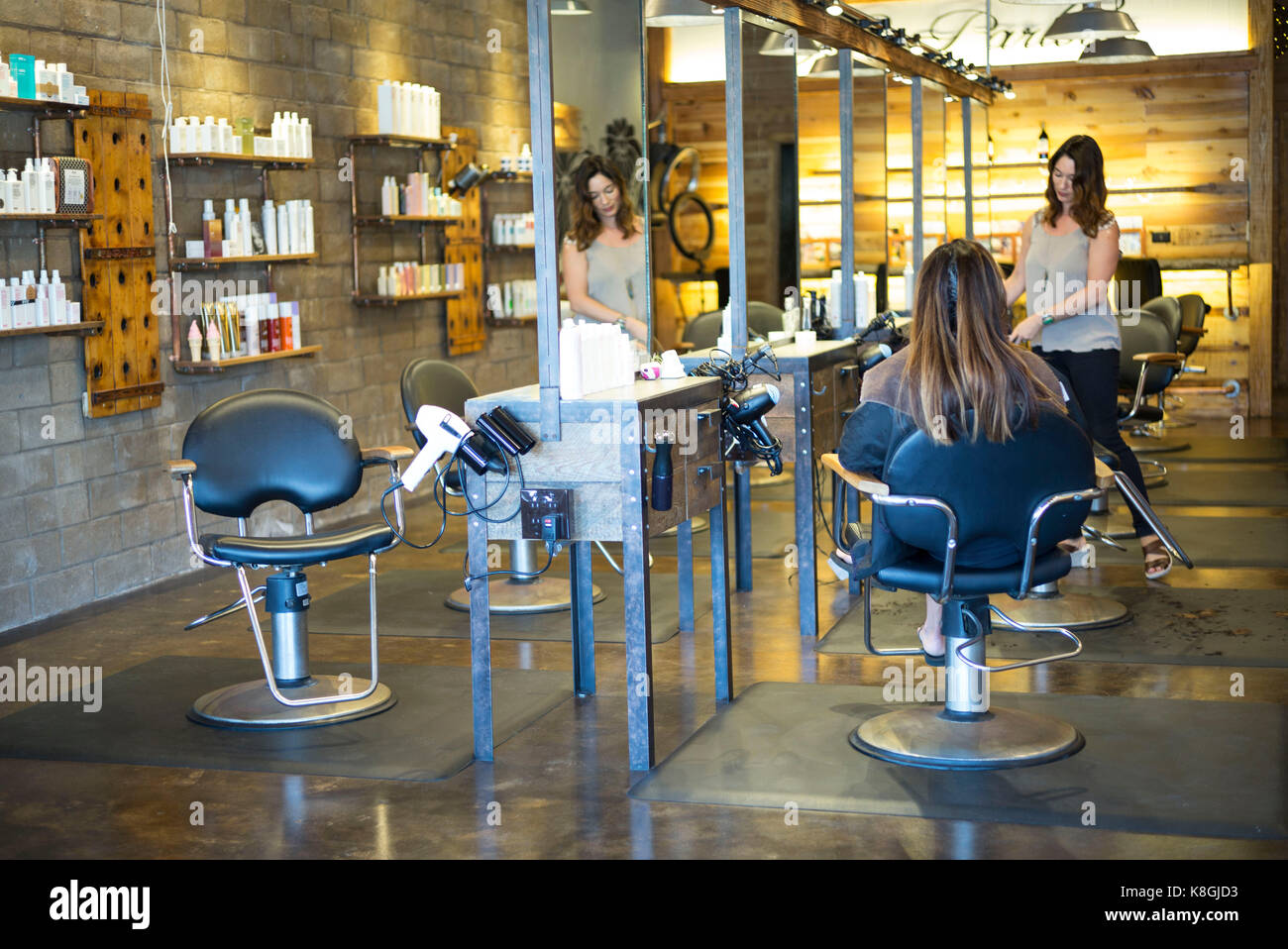 Hairstylist working in salon Stock Photo