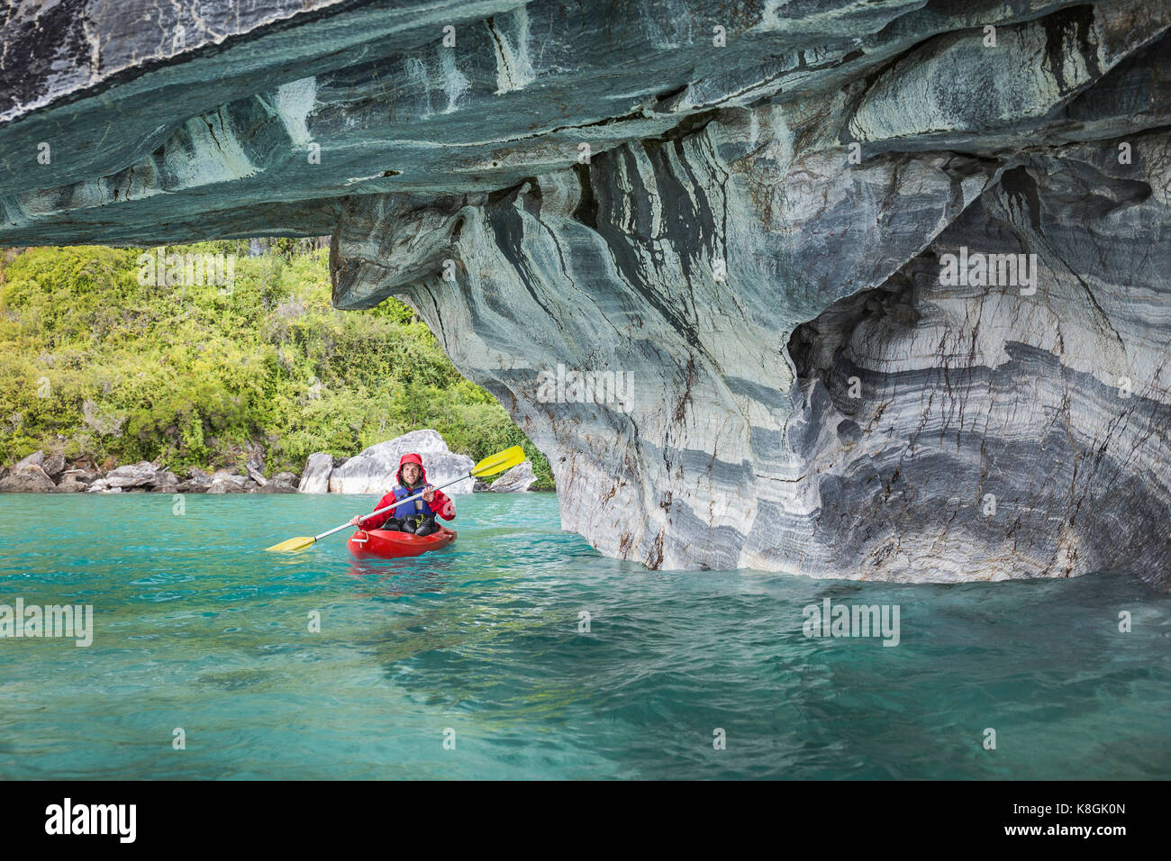 Man kayaking around marble caves, Puerto Tranquilo, Aysen Region, Chile, South America Stock Photo