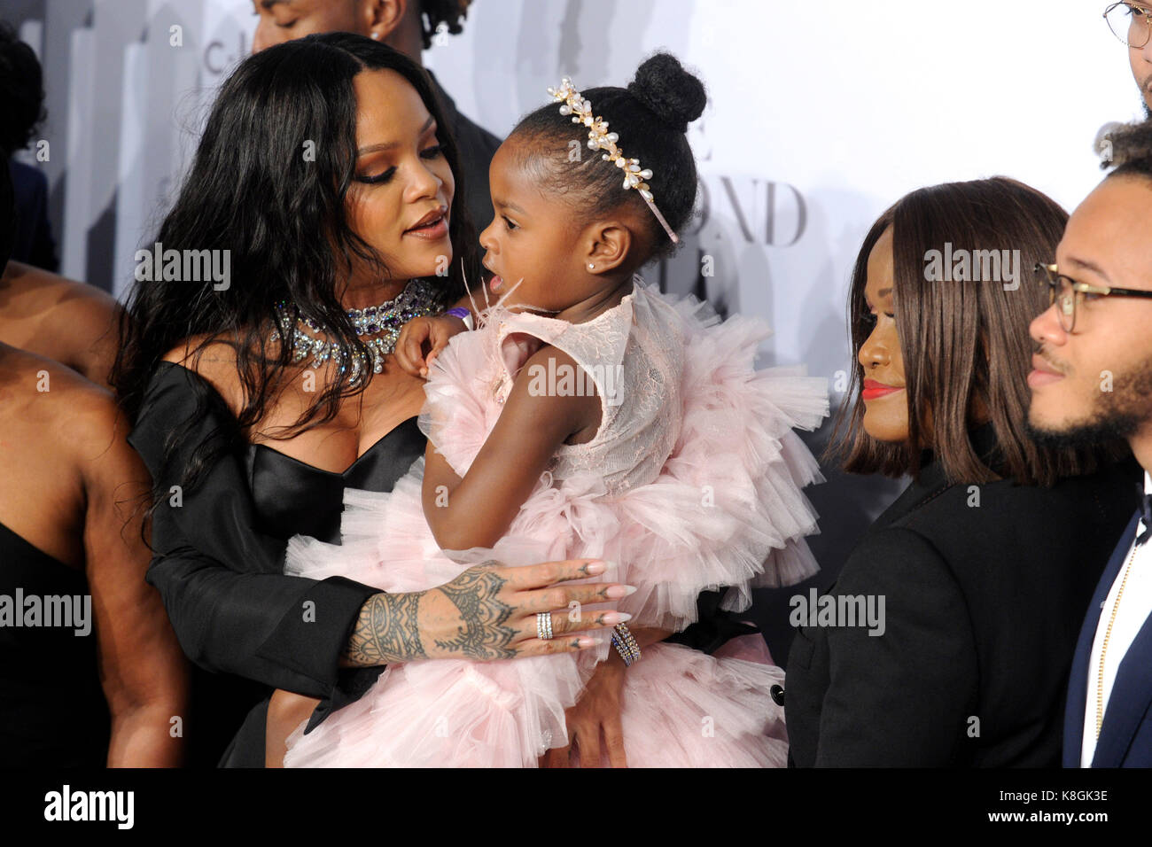 Rihanna and her family attend Rihanna's 3rd Annual Diamond Ball