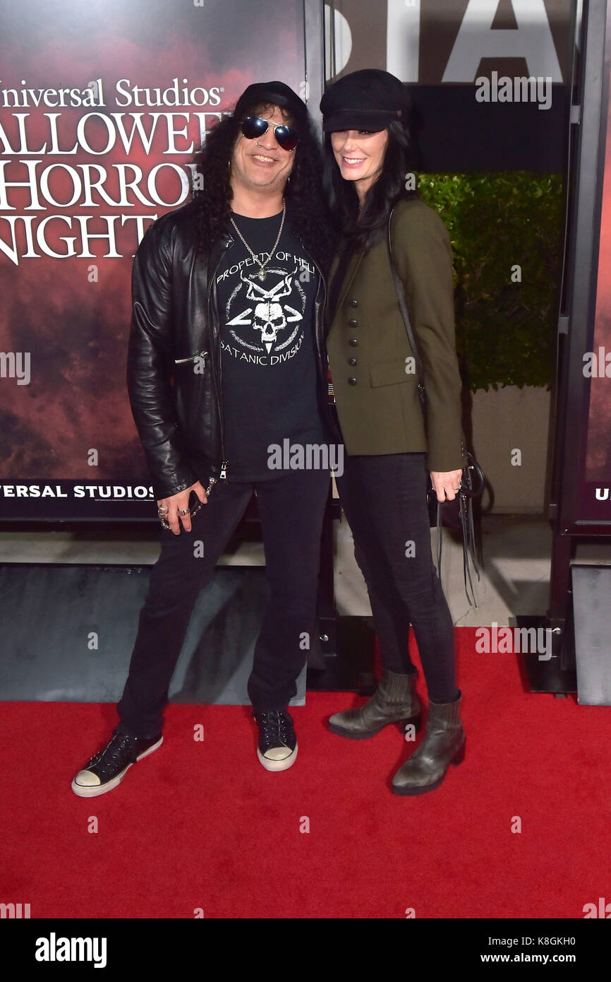 Slash (Guns n' Roses) and his girlfriend Meegan Hodges attend the Stock