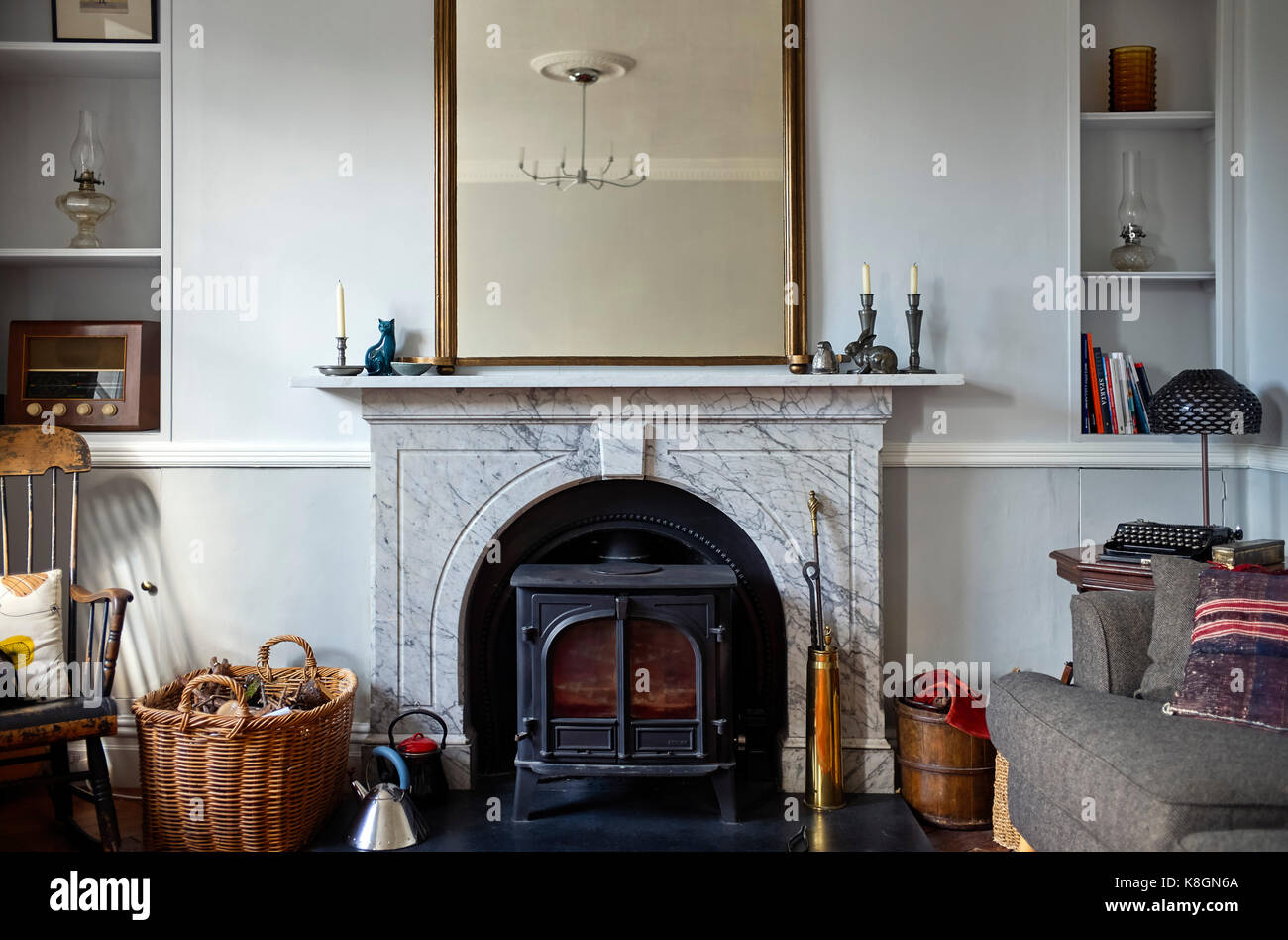 Marble fireplace with woodburning stove fitted Stock Photo