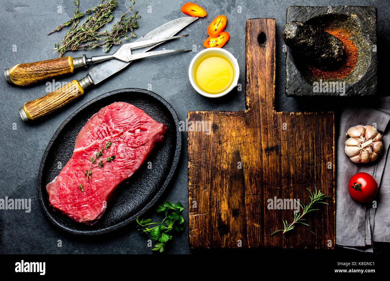 Fresh raw meat steak beef tenderloin, herbs and spices around cutting ...
