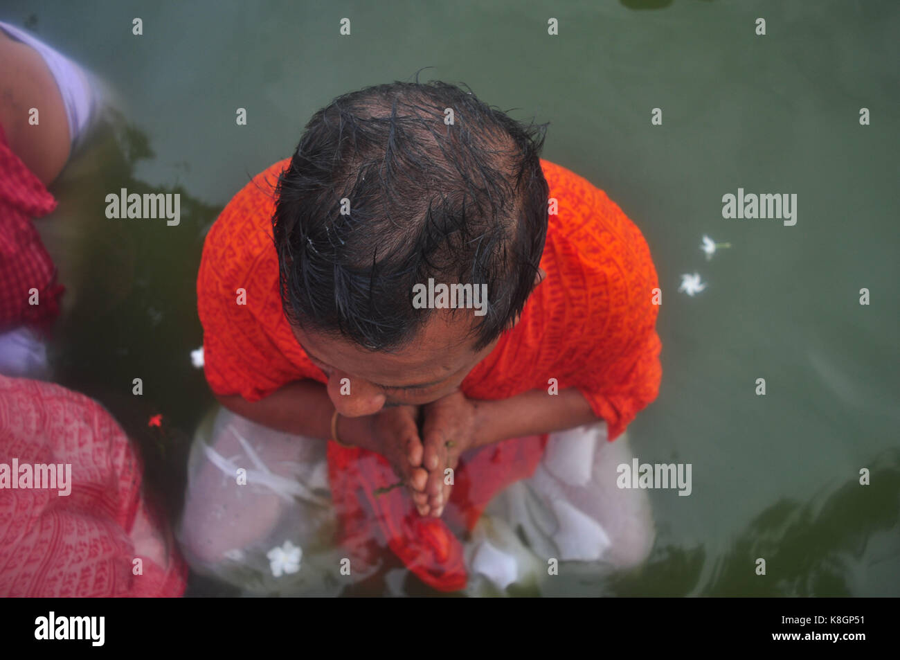 Agartala, India. 19th Sep, 2017. Indian Hindu devotees performs Tarpan, a ritual to pay obeisance to one's forefathers on the last day for offering prayers to ancestors called Pitritarpan in Tripura, India, on September 19, 2017. In Hindu mythology, this day is also called 'Mahalaya' and described as the day when the Gods created the ten armed Goddess Durga to destroy the demon king Asur who plotted to drive out the gods from their kingdom. The five-day period of worship of Durga, who is attributed as the destroyer of evil. Credit: Abhisek Saha/Pacific Press/Alamy Live News Stock Photo
