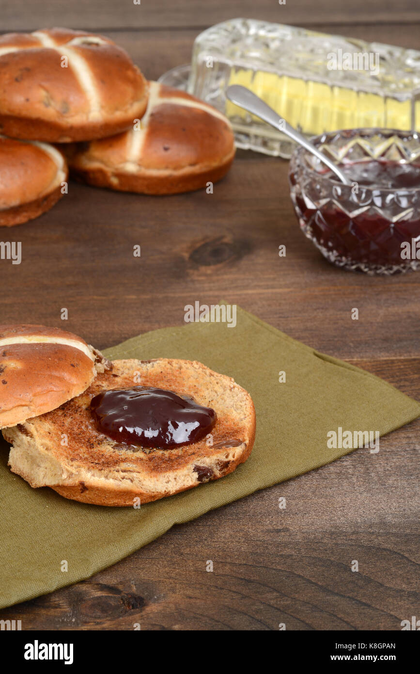 toasted hot cross bun with strawberry jam Stock Photo Alamy
