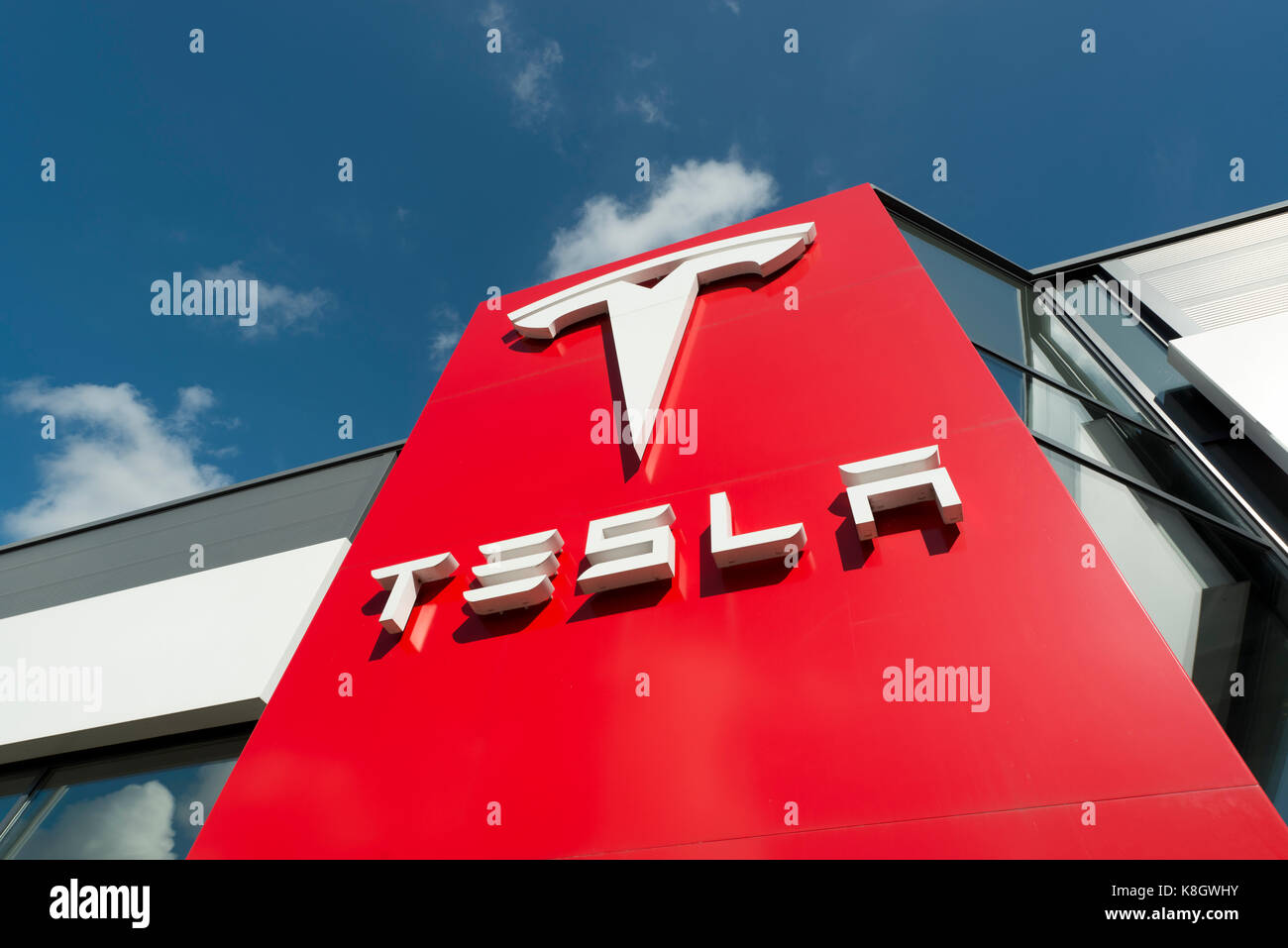 The signage for a Tesla car showroom located in Heaton Chapel and listed as South Manchester, in the UK (Editorial use only). Stock Photo