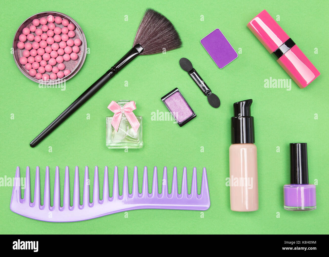 Set of cosmetic bag essentials foundation, blush, lipstick, eyeshadow