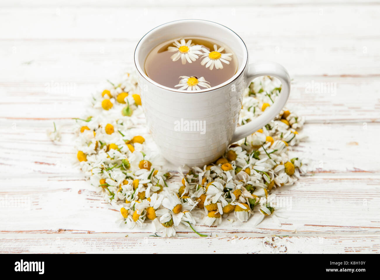Chamomile tea in a white cup Stock Photo - Alamy
