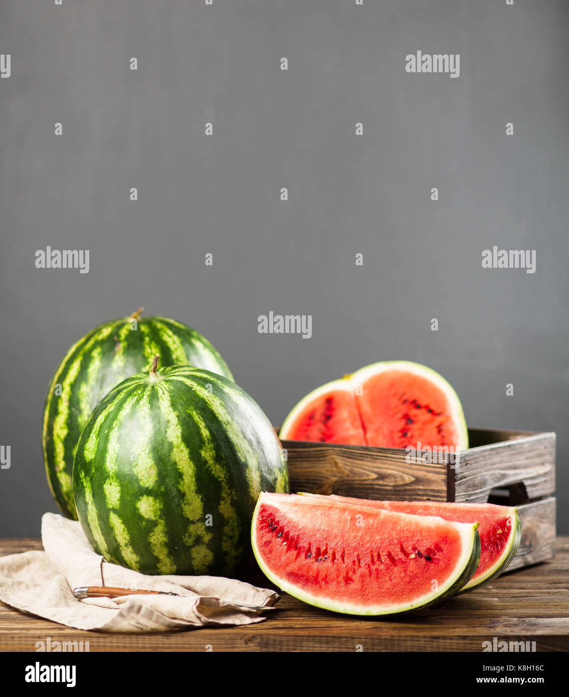 Ripe juicy watermelons on a wooden table Stock Photo