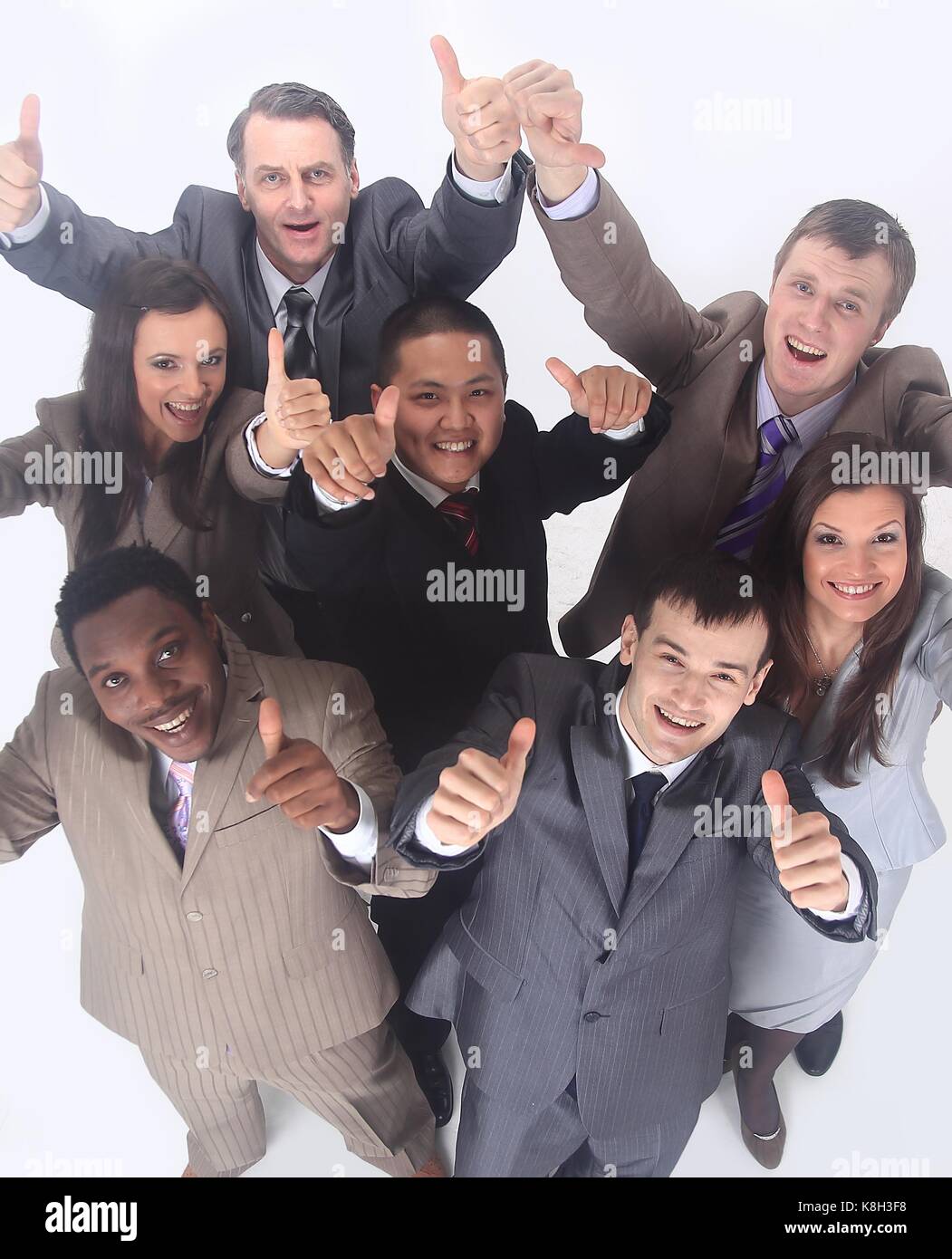 multicultural business team with thumbs up Stock Photo - Alamy