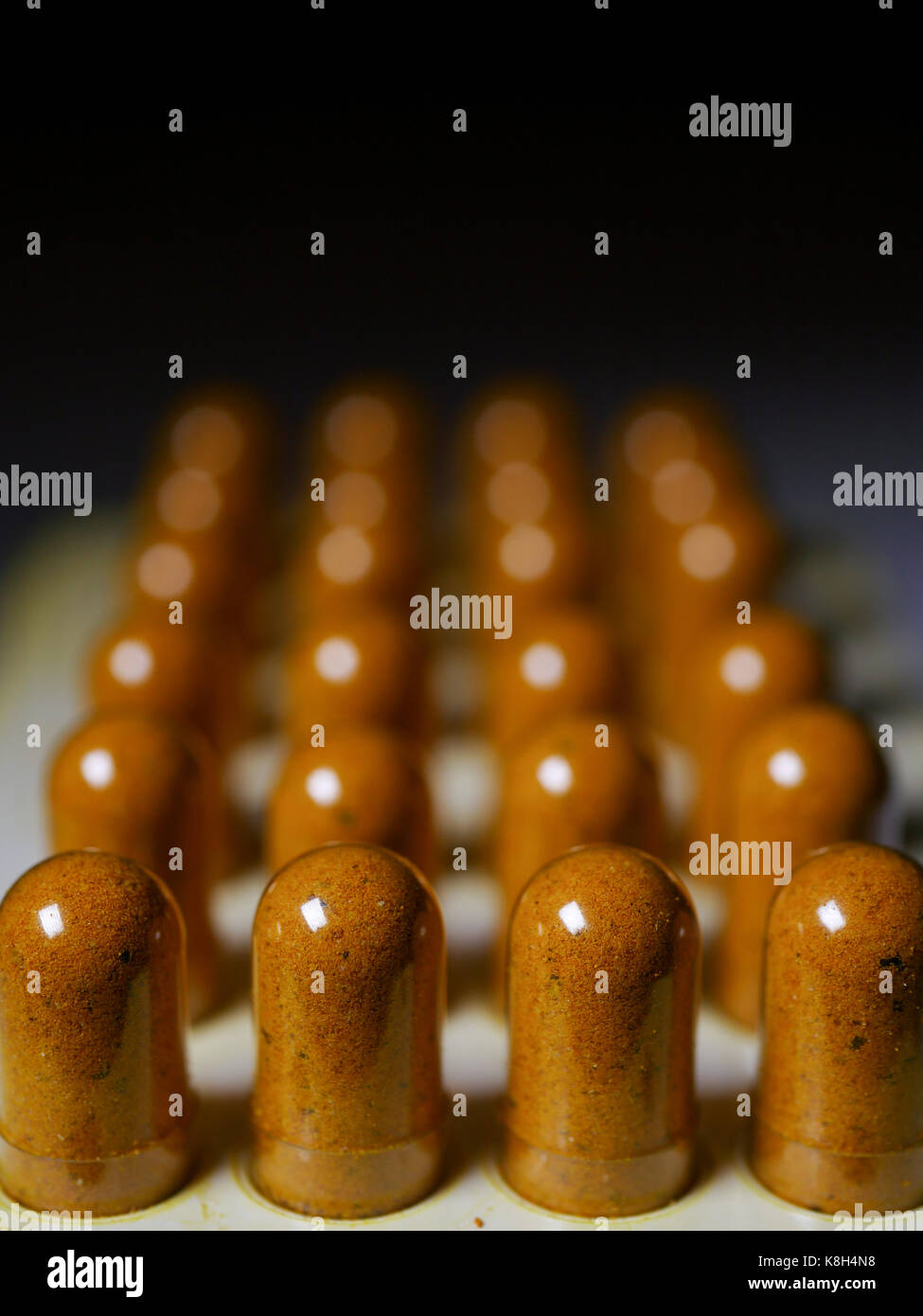 Rows of homemade turmeric capsules Stock Photo Alamy