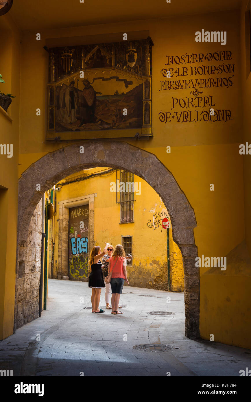 Valencia Spain old town, view of a group of women talking in a narrow street in the old town Barrio del Carmen - El Carmen - area of Valencia, Spain. Stock Photo