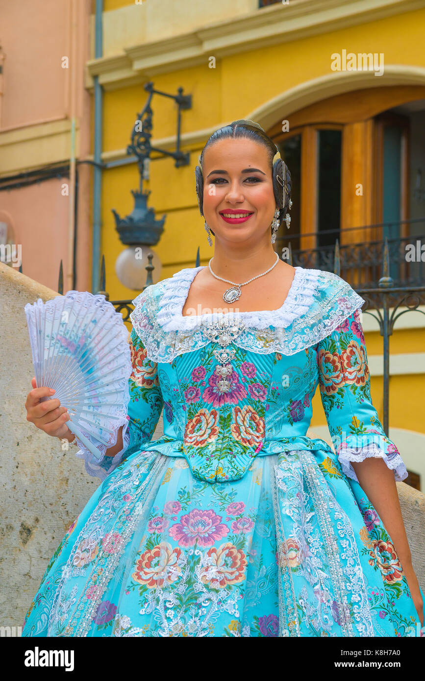 Spanish traditional costume, portrait of a young smiling Spanish woman  wearing traditional Valencian dress, Valencia, Spain. Stock Photo
