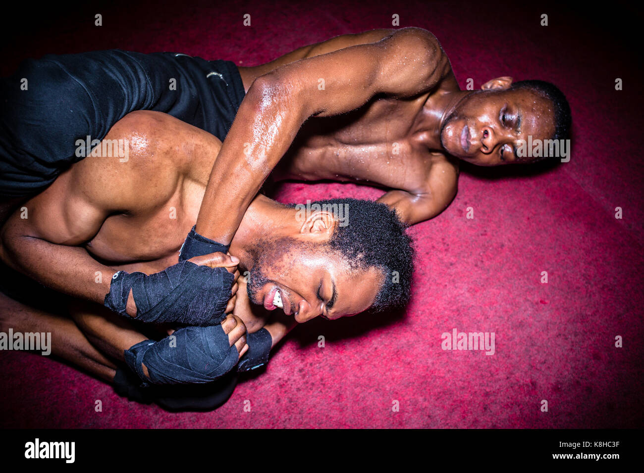 Two African American opponents struggling for dominance in groun Stock Photo