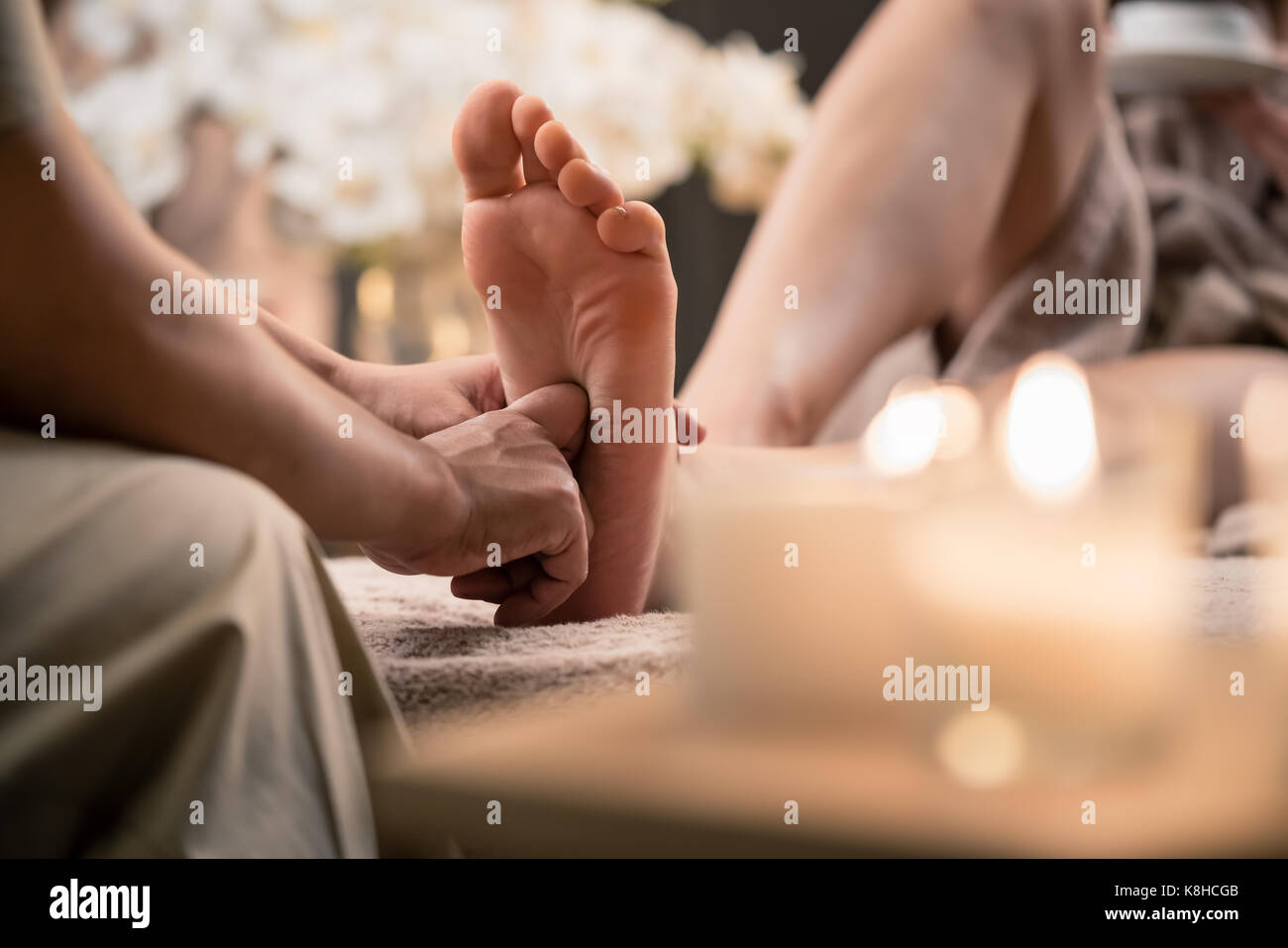 Woman having reflexology foot massage in wellness spa Stock Photo