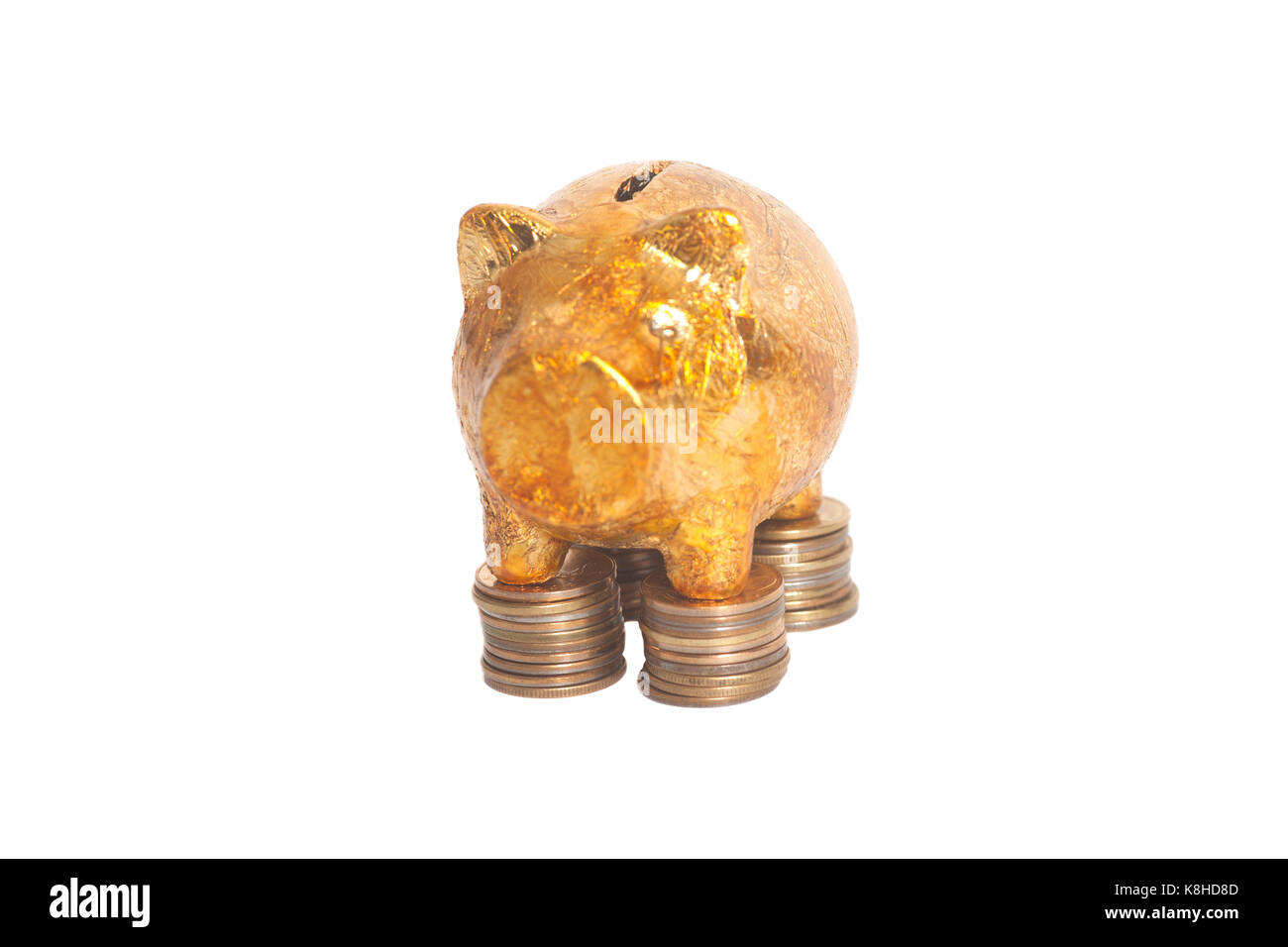 Golden piggy bank on stack coins isolated on white background Stock ...