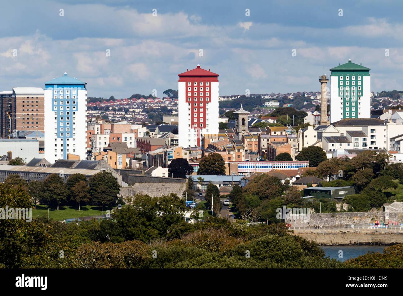 Colourful fire risk cladding of three tower blocks (l to r Tavy,Tamar, Lynher) dominate a view of Devonport, Plymouth, UK Stock Photo