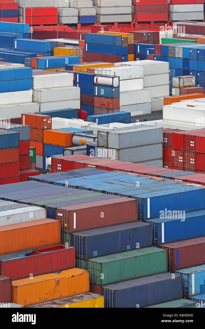 Shipping containers stacked at cargo port Stock Photo