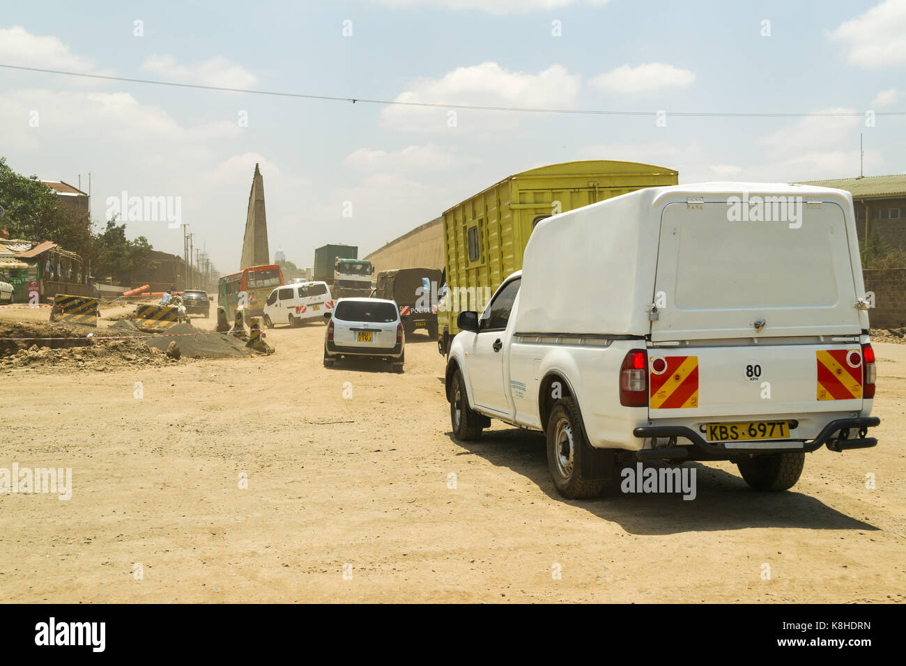 Vehicles drive down Enterprise Road whilst under construction, Nairobi, Kenya Stock Photo