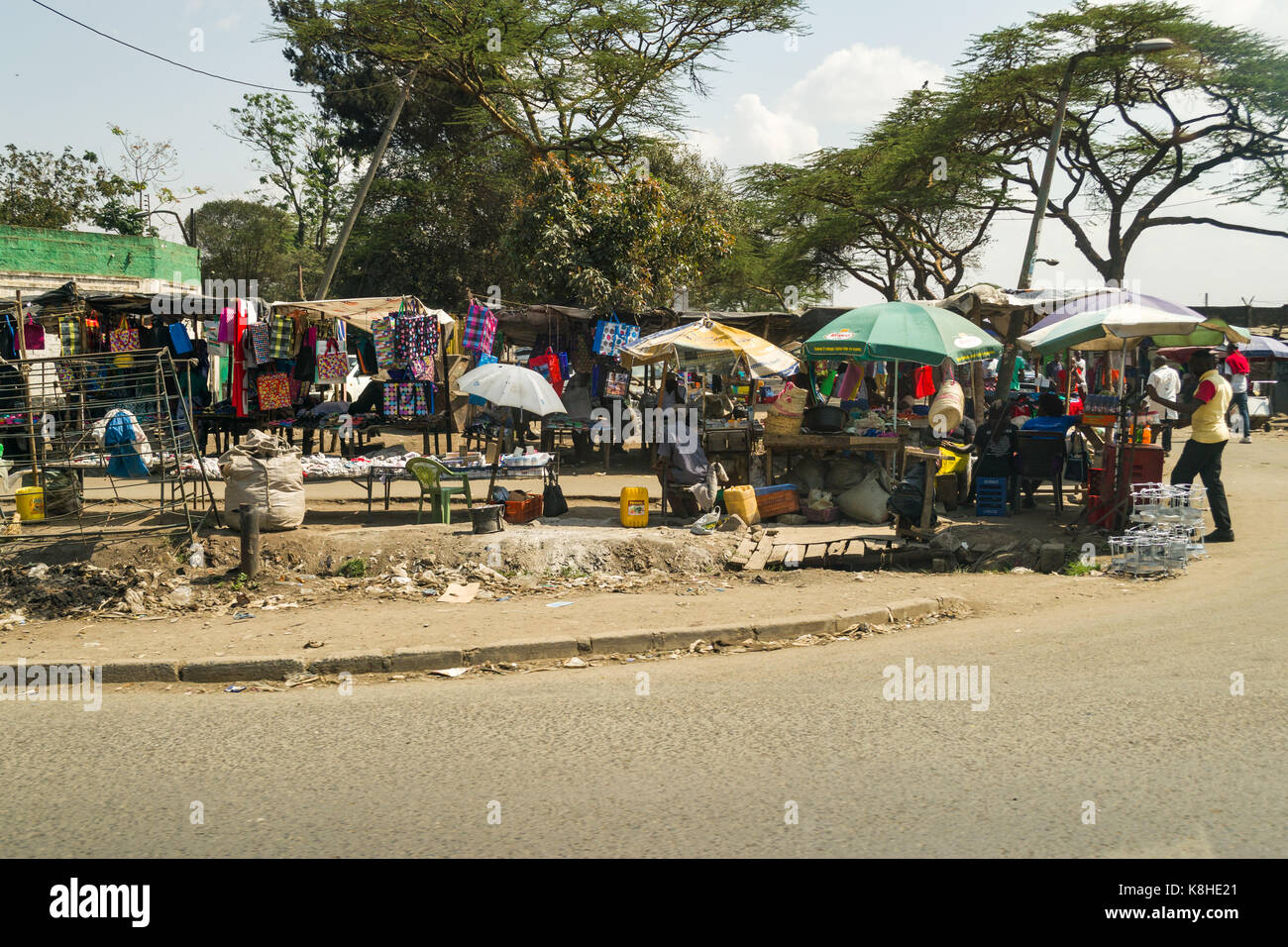 Various roadside stalls selling goods with people looking, Nairobi, Kenya Stock Photo