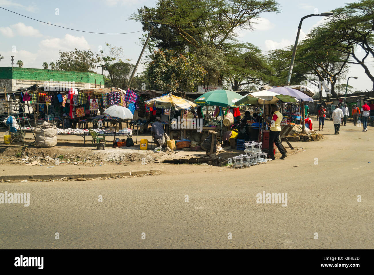 Various roadside stalls selling goods with people looking, Nairobi, Kenya Stock Photo