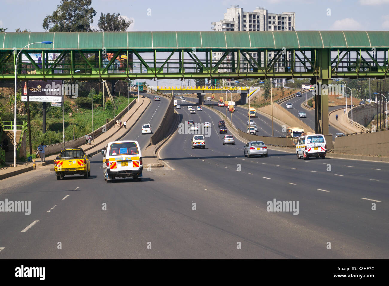 Thika Highway with vehicles and pedestrian overpass, Nairobi, Kenya Stock Photo