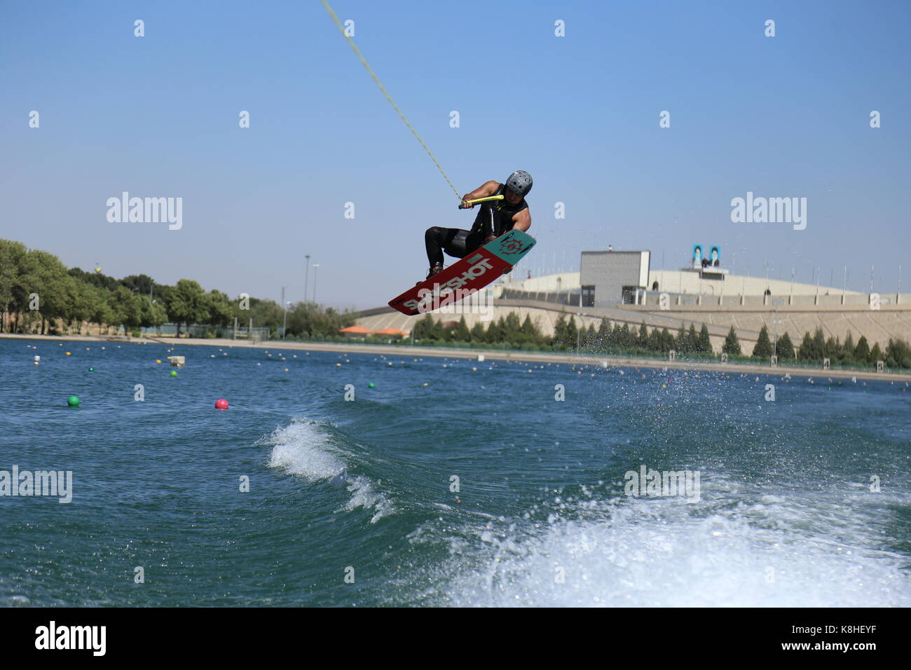 Wakeboarding tail grab Stock Photo Alamy