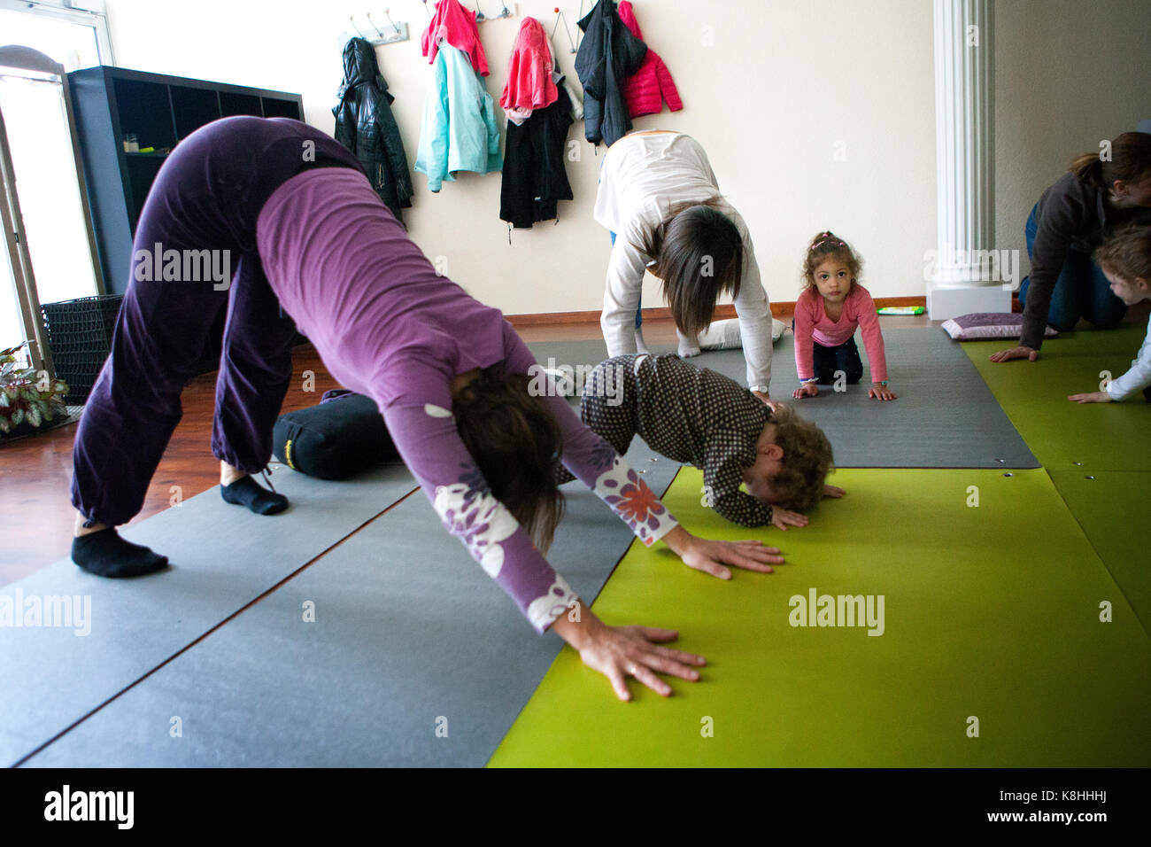 PARENT AND CHILD PRACTICING YOGA Stock Photo