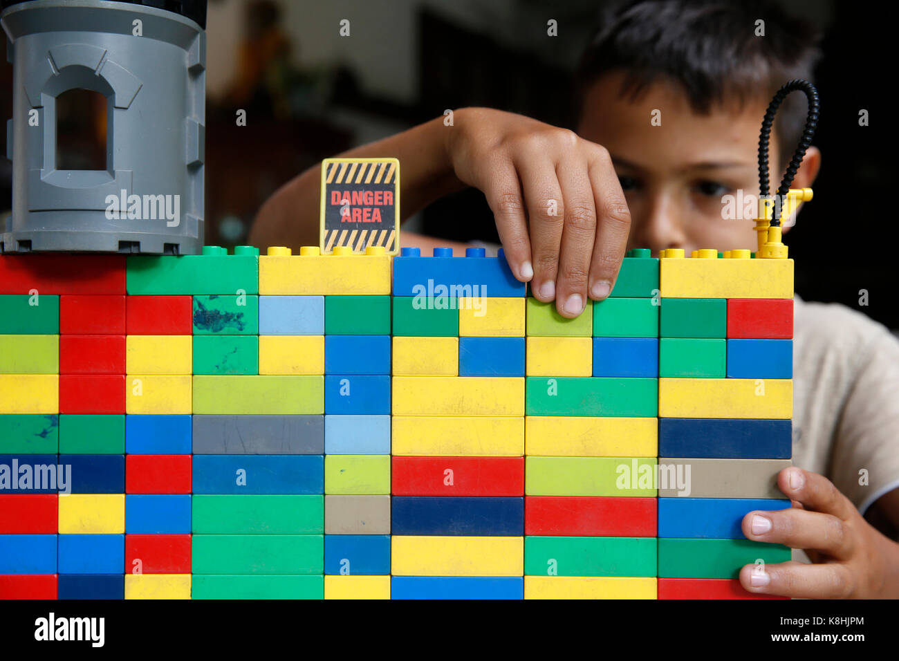 10-year-old boy playing with lego. thailand. Stock Photo