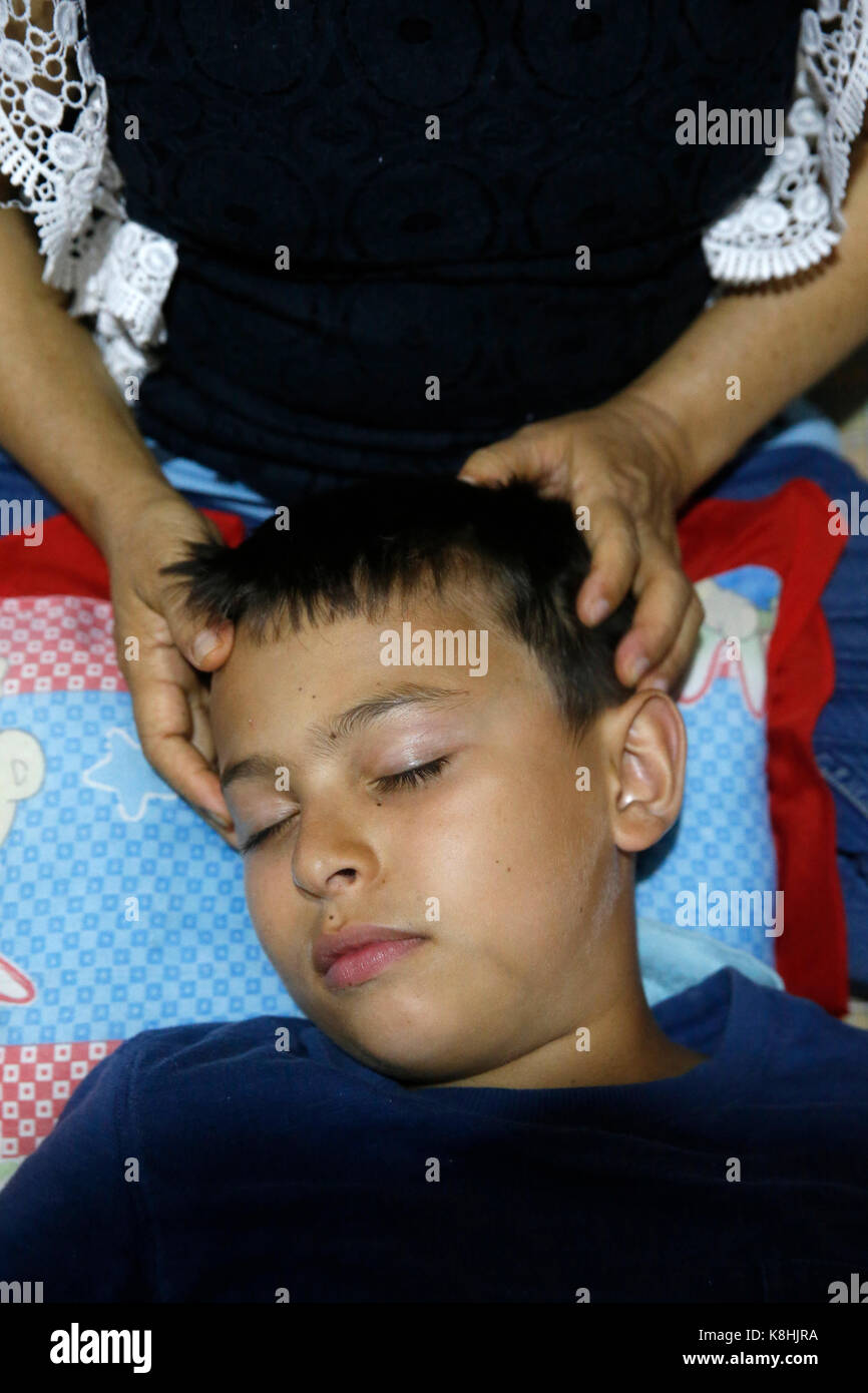 Boy receiving a thai massage. thailand. Stock Photo