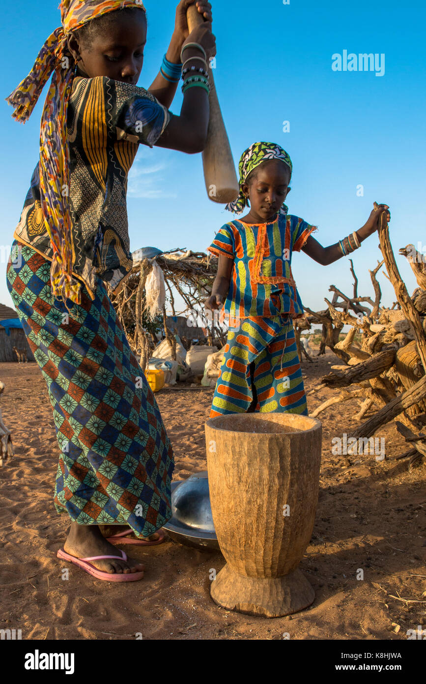 Girls using a pestle. senegal. Stock Photo