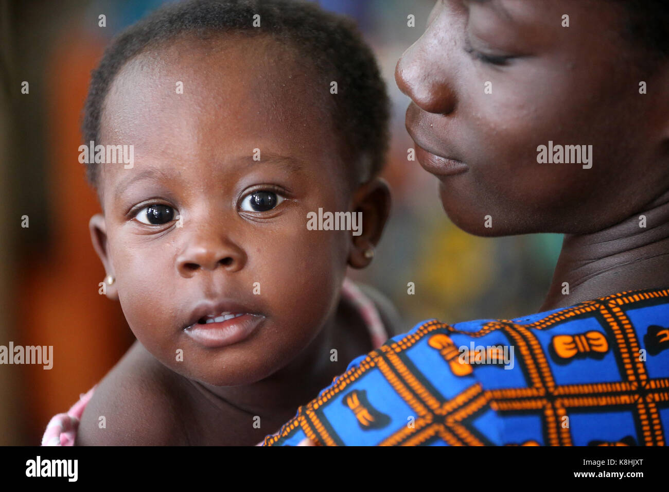 African village life. woman with her baby. lome. togo. Stock Photo