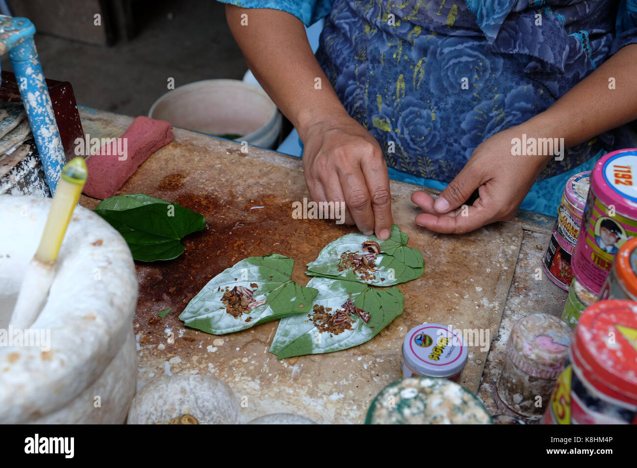 burmese tobacco Burma, Myanmar: betel or Kun Ja cultivation in a street of Rangoon. Mixture  of tobacco, areca nuts, spices on a betel leaf Stock Photo