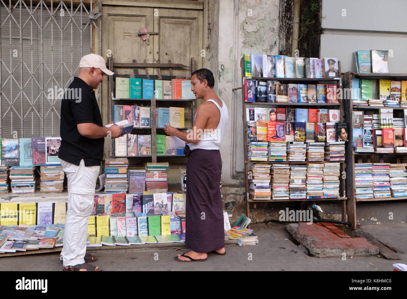 Burma, Myanmar: books of a street bookseller in Rangoon. Stock Photo