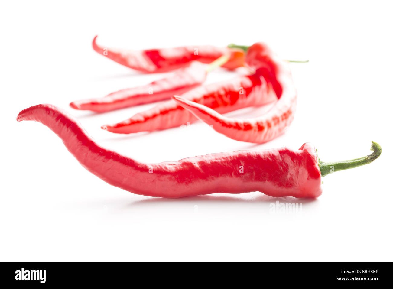 Red chili peppers isolated on white background Stock Photo - Alamy