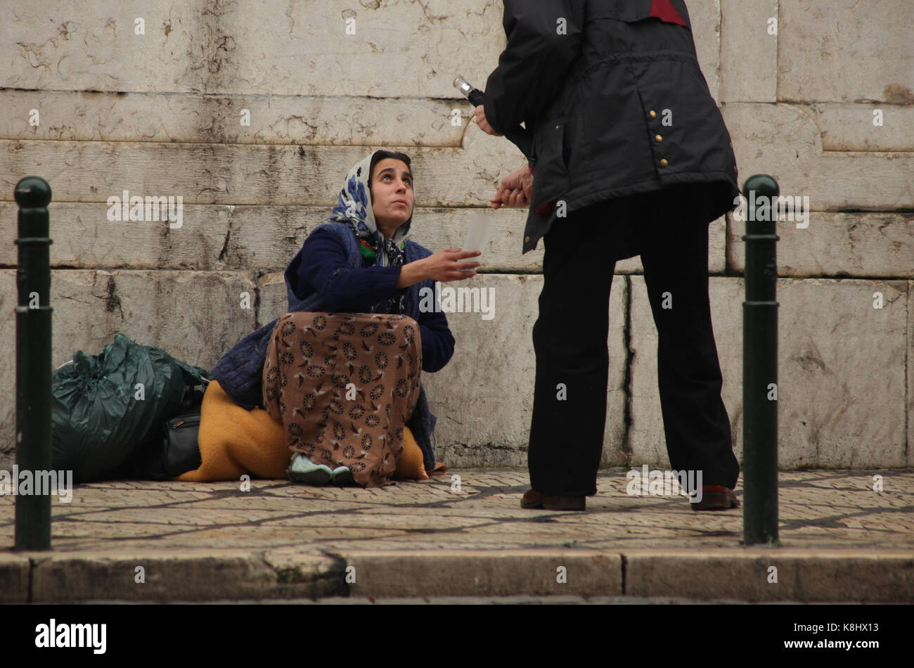 A gypsy woman begs along the streets in Lisbon on February 7, 2010 ...