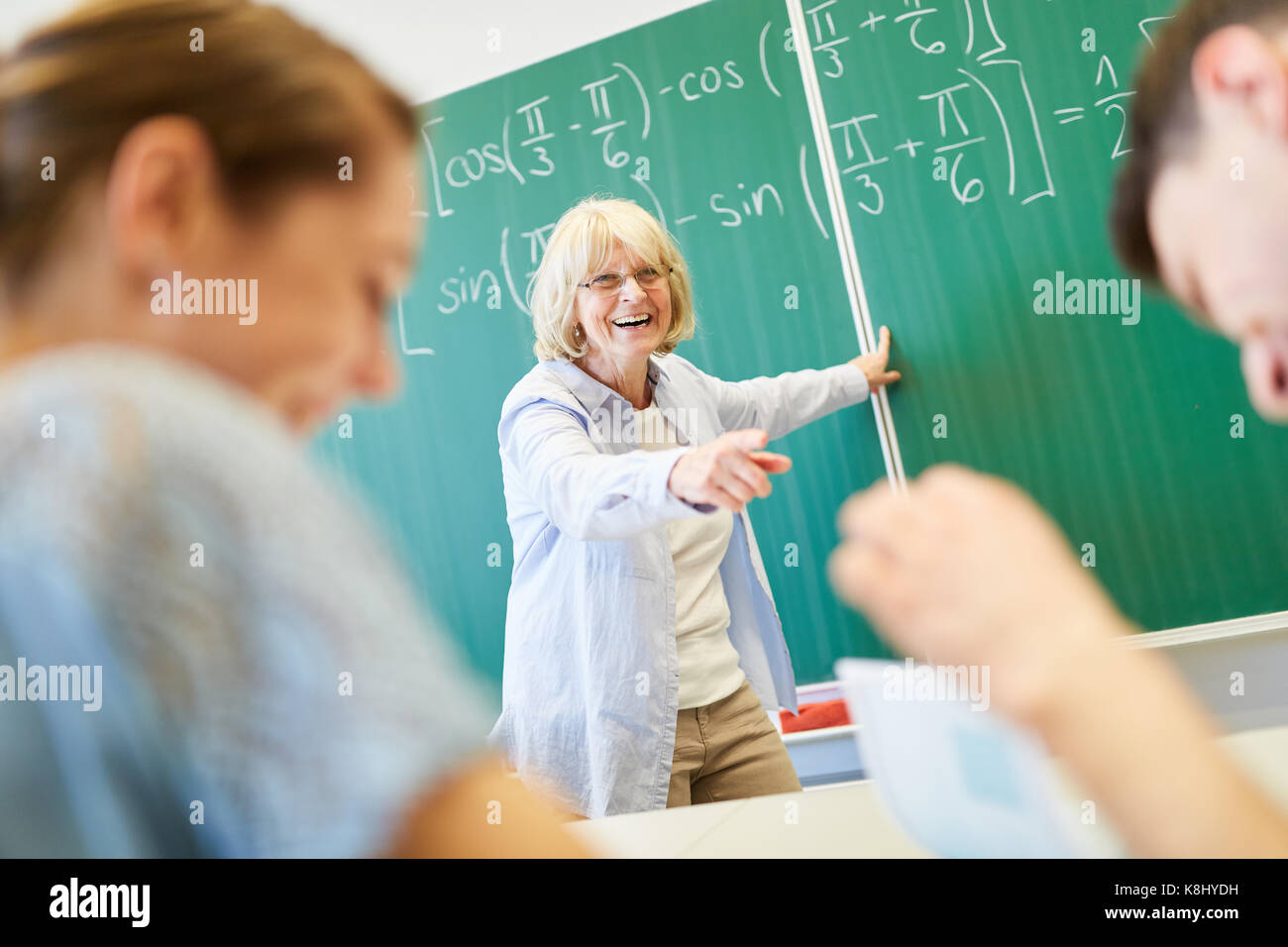 Teacher and students having fun in school at math class Stock Photo