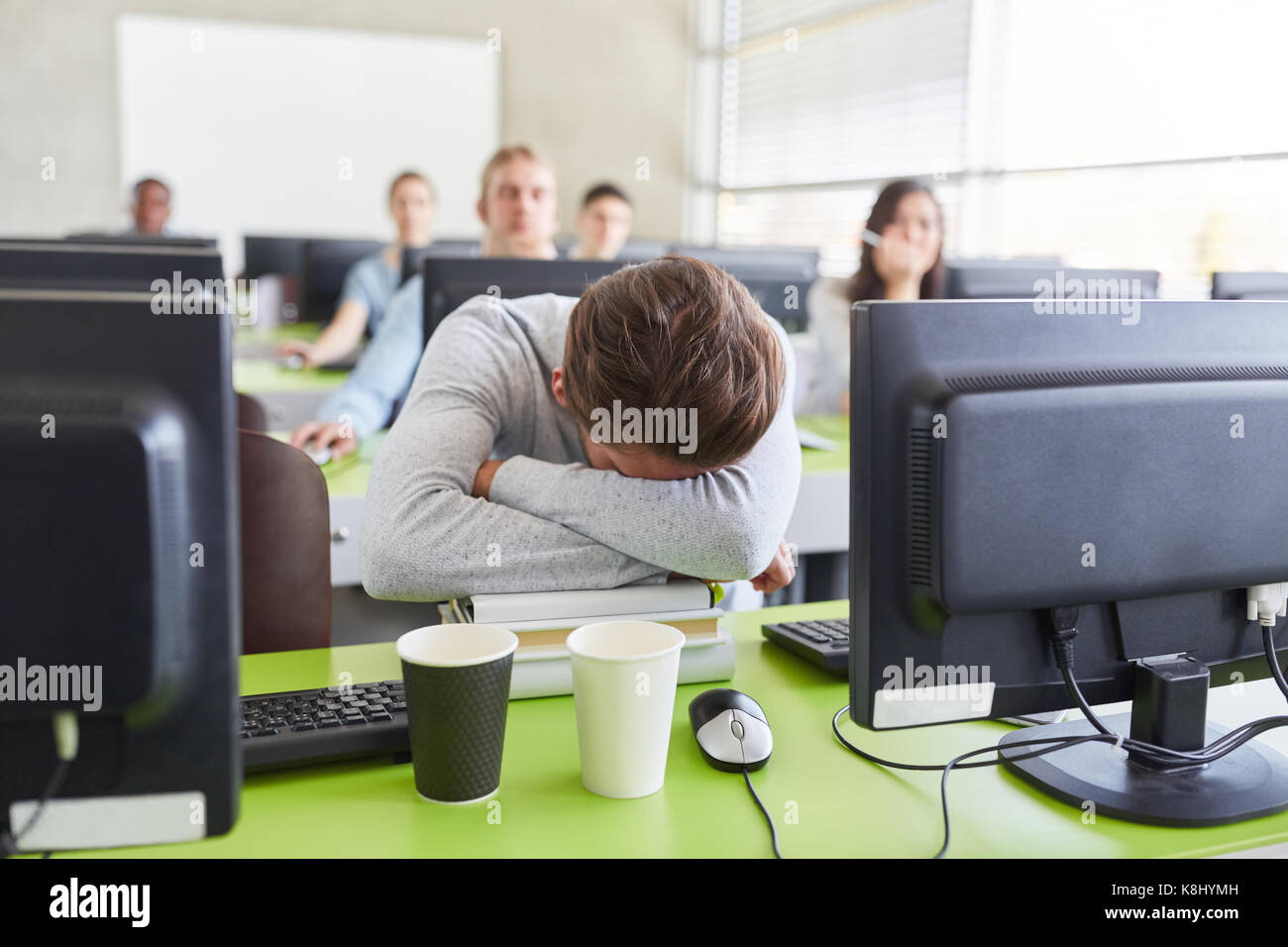 Student with Burnout and exhaustion in computer course at university Stock Photo