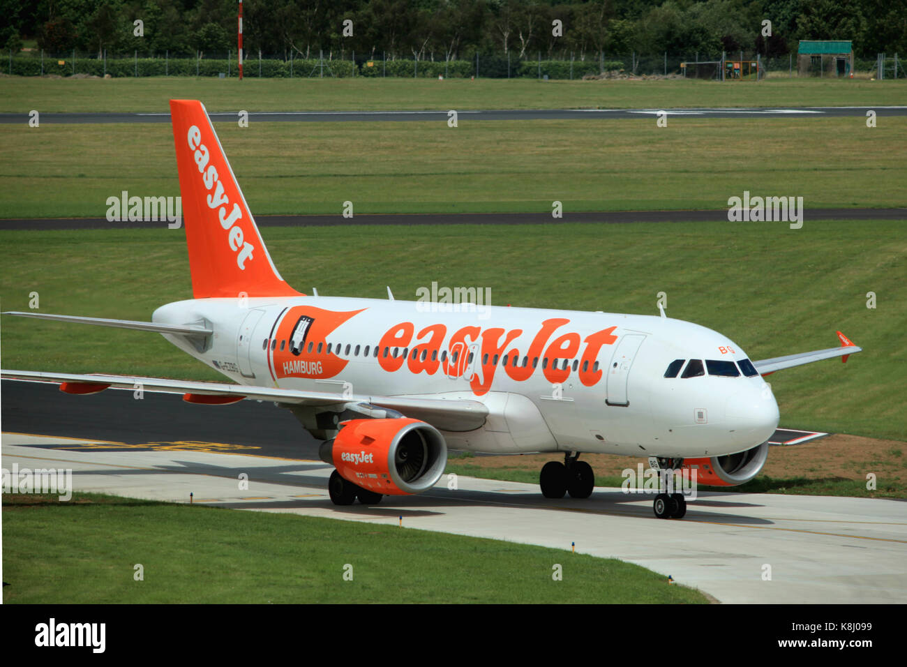 EasyJet Airbus A319 G-EZBG taxiing to terminal building at London Southend Airport, Essex, England Stock Photo