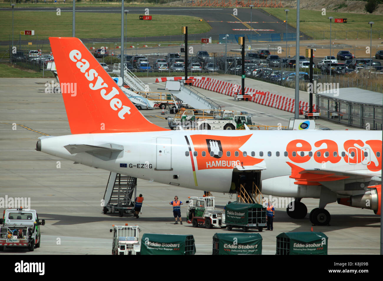 EasyJet Airbus A319 G-EZBG being unloaded, terminal building at London Southend Airport, Essex, England Stock Photo