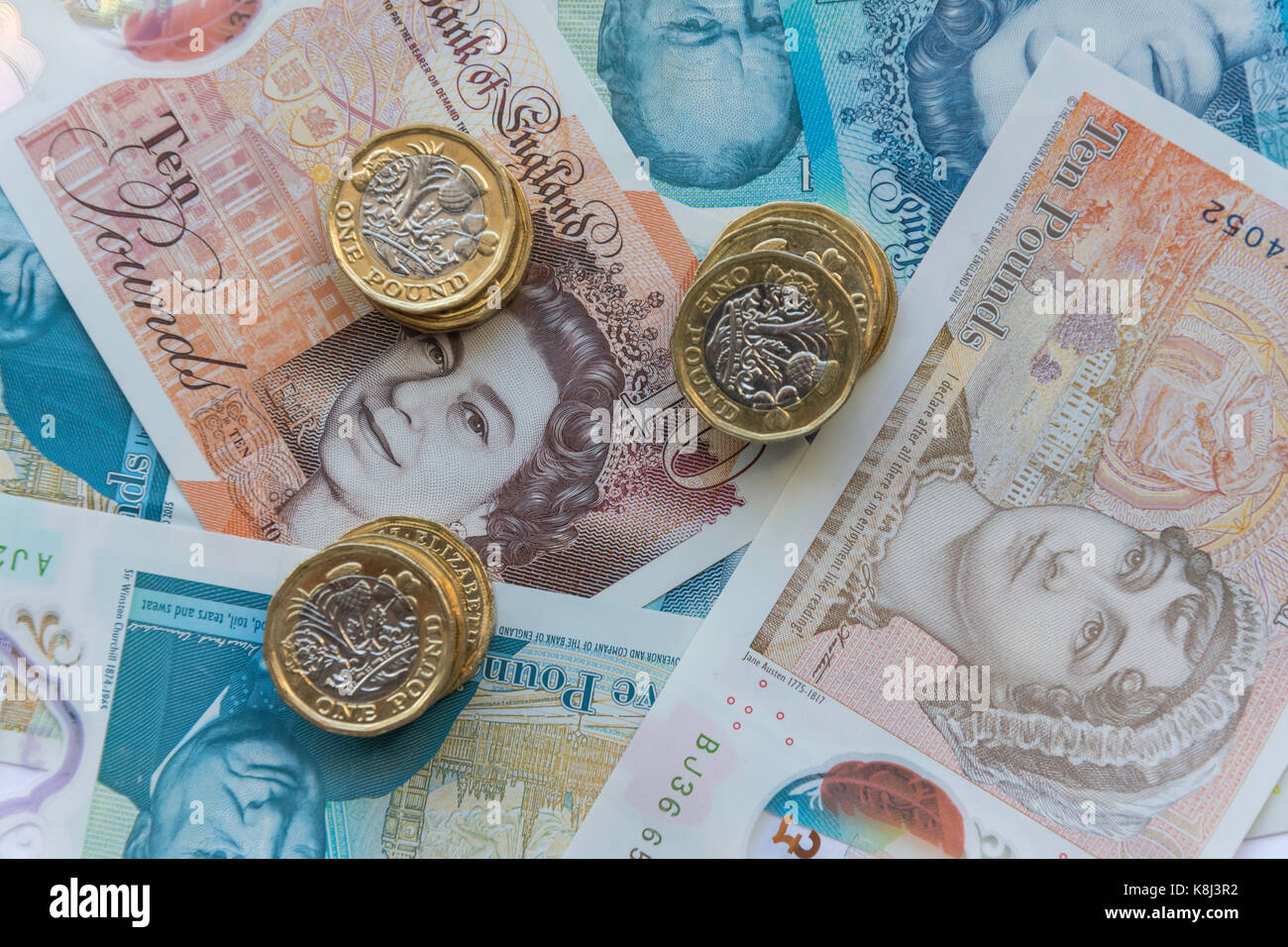 New British currency (one pound coins, five pound and ten pound notes, London, England, United Kingdom Stock Photo