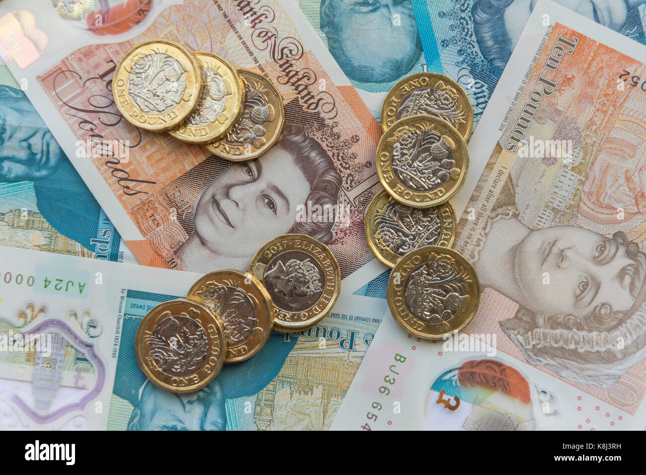 New British currency (one pound coins, five pound and ten pound notes, London, England, United Kingdom Stock Photo