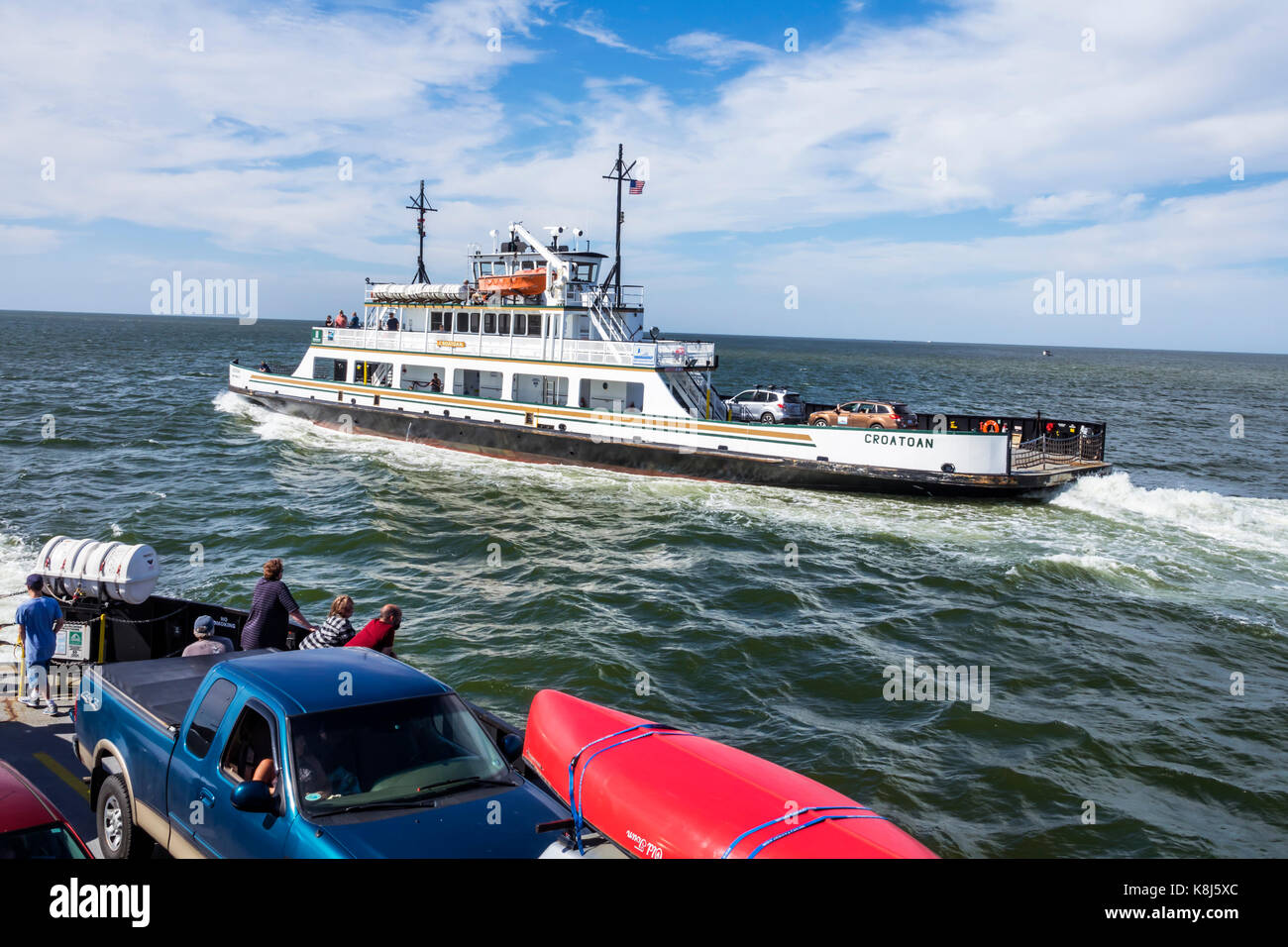 North Carolina,NC,Outer Banks,Pamlico Sound,Ocracoke Island,Hatteras,ferry,water,navigating,vehicles,waves,passing boat,NC170518140 Stock Photo