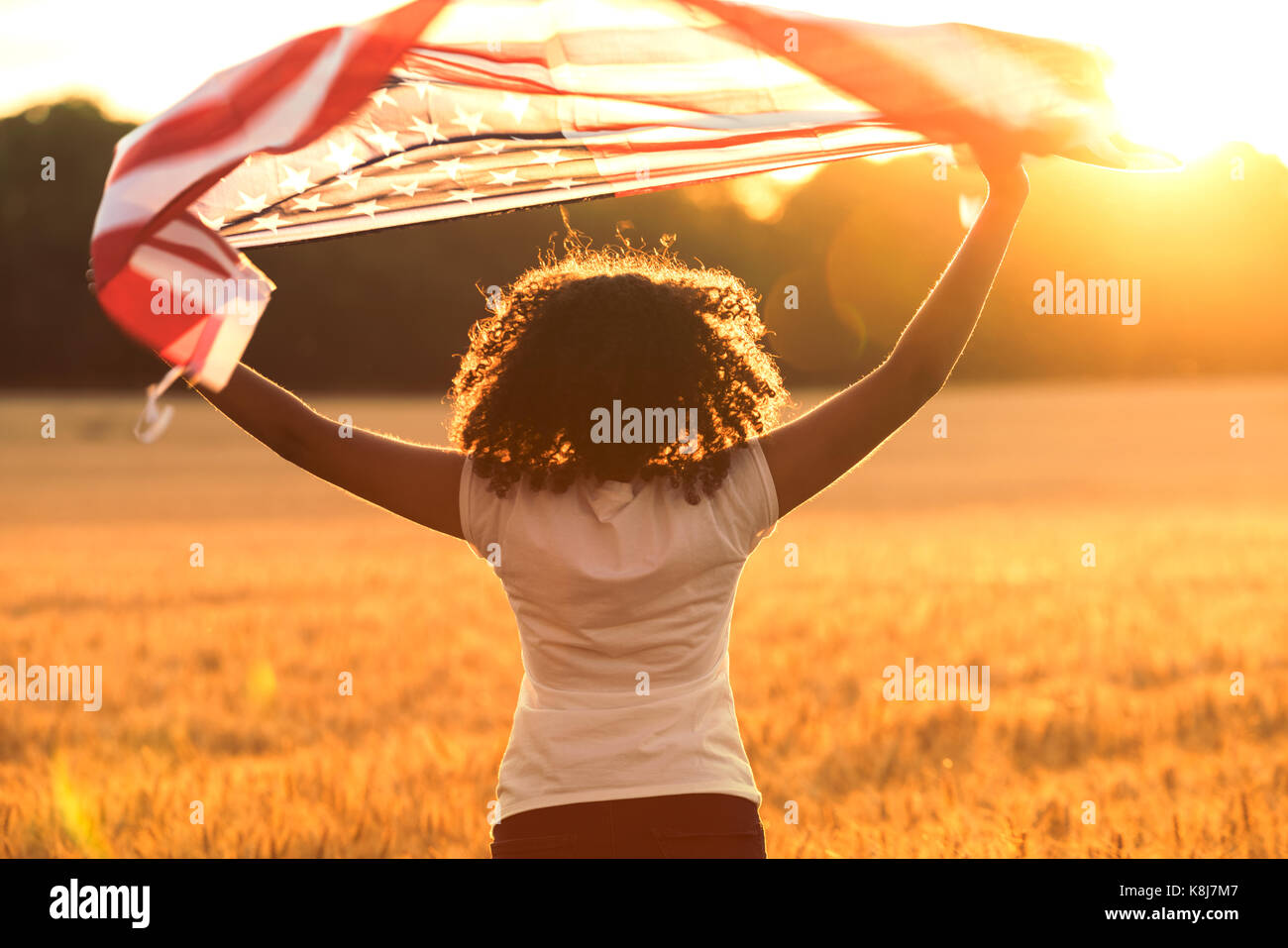 Rear view of mixed race African American girl teenager female young ...